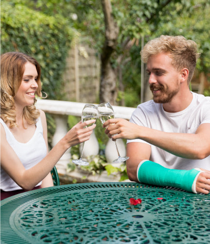 benecare medical, young couple enjoying the sun, man has a broken arm in casting tape