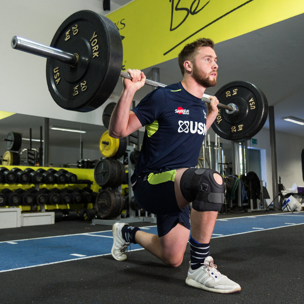 George Nott of Sale Sharks Rugby Club doing a lunge wearing the Benecare Hinged Knee Stabiliser.